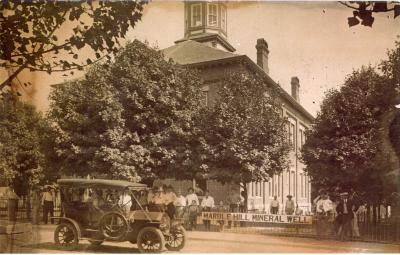  Court House & Mineral Well with iron fence around court house.